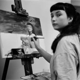 Lucia painting self-portrait